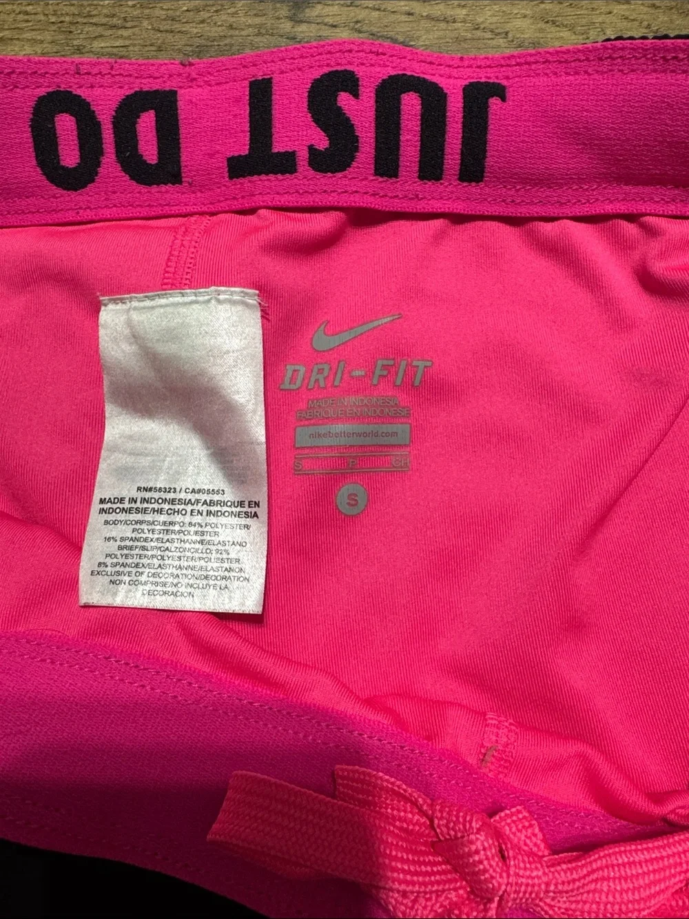 Nike Black Women's Athletic Shorts with Pink Swoosh